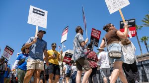 Members and supporters of SAG-AFTRA and WGA walk the picket line at Fox Studios on July 27, 2023