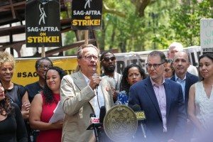 NEW YORK, NEW YORK - AUGUST 1: Lowell Peterson joins SAG-AFTRA members as SAG-AFTRA and the WGA hold a rally at City Hall on August 1, 2023 in New York City. Members of SAG-AFTRA and WGA (Writers Guild of America) have both walked out in their first joint strike against the studios since 1960. The strike has shut down a majority of Hollywood productions with writers approaching the third month of their strike against the Hollywood studios. (Photo by John Nacion/Getty Images)